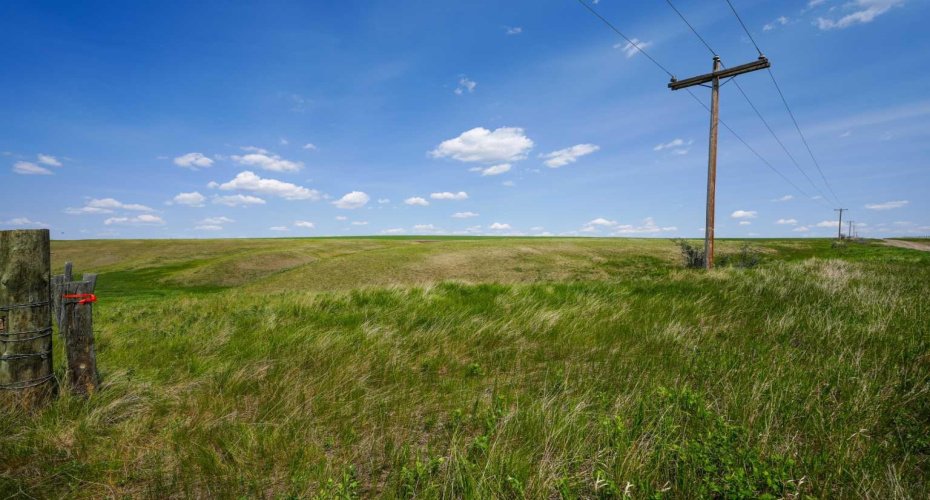 Power line leading into property and coulee vista views.