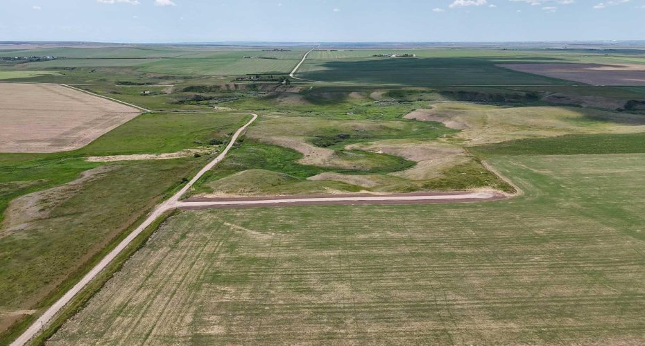 Drone view of Property surrounded by prairie.