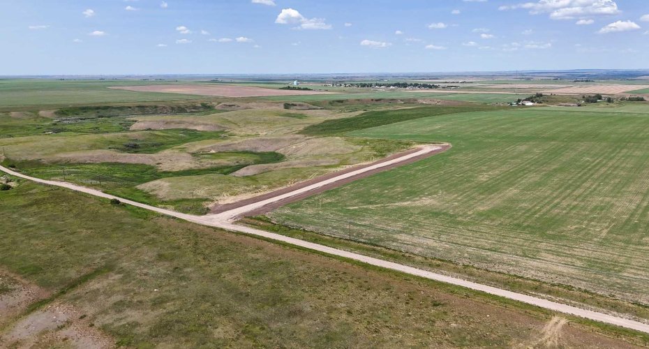Drone view of property with surrounded prairies.