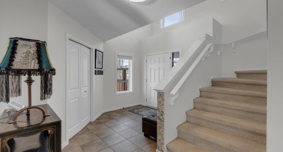 WELCOMING FOYER AND STAIRS