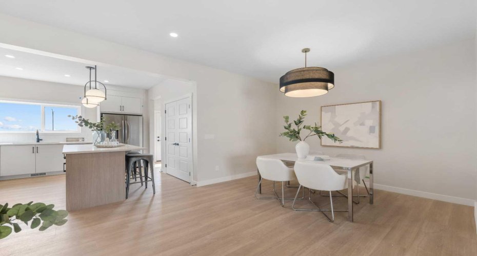 Photos are representative of 60 Buffaloberry Manor SE - same floor plan built by Genesis Builders Group. Finishes may differ.