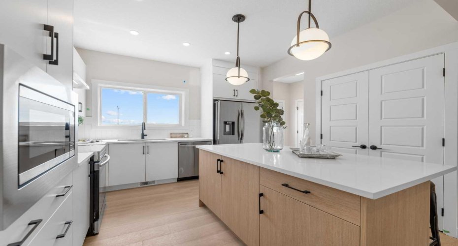 Photos are representative of 60 Buffaloberry Manor SE - same floor plan built by Genesis Builders Group. Finishes may differ.