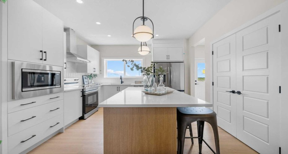 Photos are representative of 60 Buffaloberry Manor SE - same floor plan built by Genesis Builders Group. Finishes may differ.