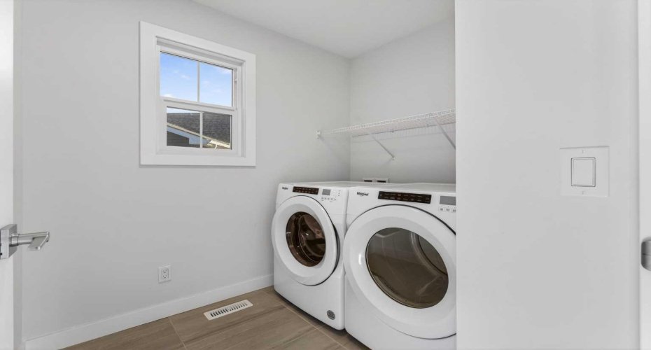 Laundry room conveniently located on upper floor