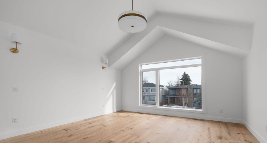 Peaked and Vaulted Primary Bedroom