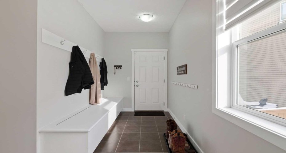 Spacious mudroom with built-in storage benches.