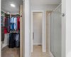 Walk-in closet with custom built-ins.