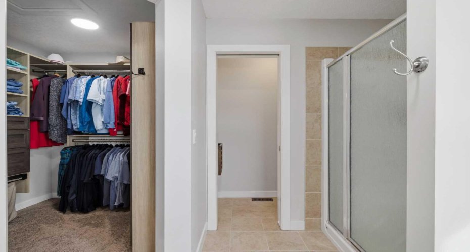 Walk-in closet with custom built-ins.
