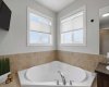 Corner soaker tub with up/down blinds.