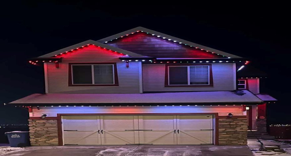 Gemstone lighting on the front of the home.
