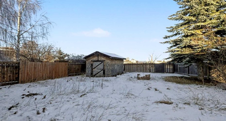 Backyard backing greenspace + park