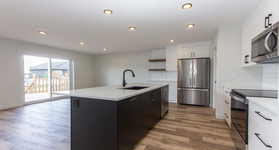 Photos and renderings are examples from a similar home built previously and do not necessarily reflect the finishes and colours used in this home.