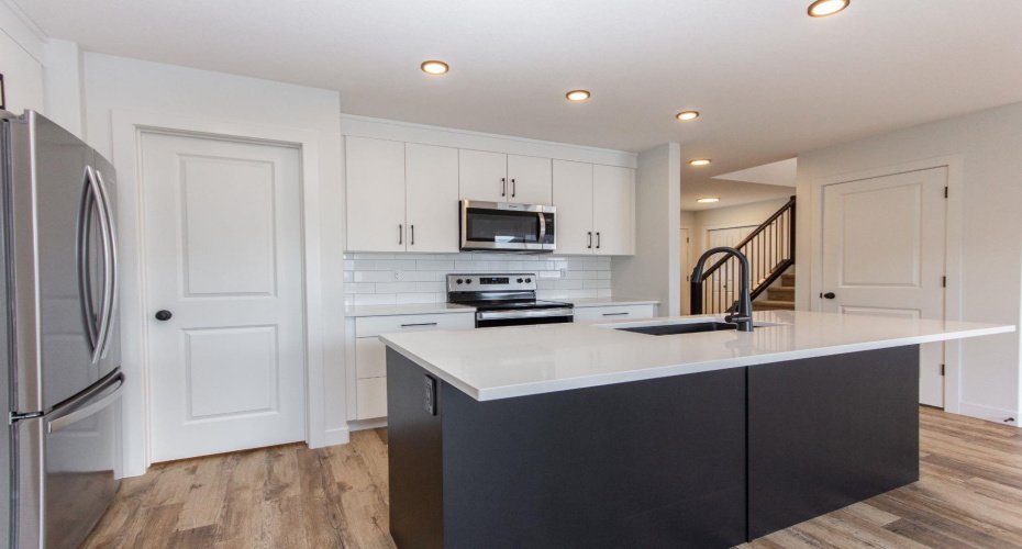 Photos and renderings are examples from a similar home built previously and do not necessarily reflect the finishes and colours used in this home.