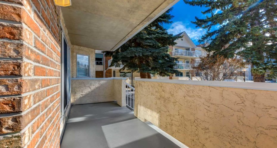 Sunny SW courtyard facing balcony