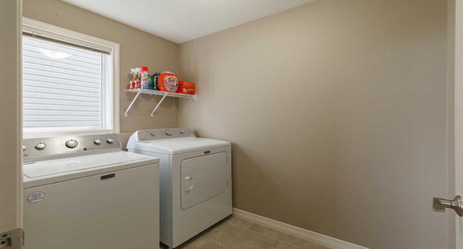 Laundry room on the upper level next to the bonus room