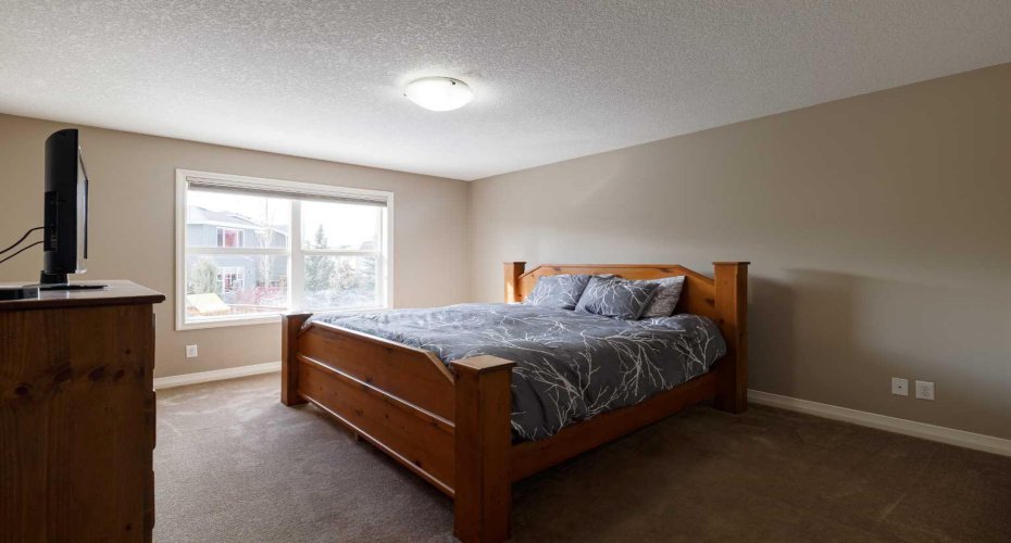 Primary bedroom with lots of light will fit a king bed