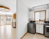 Laundry with kitchen behind