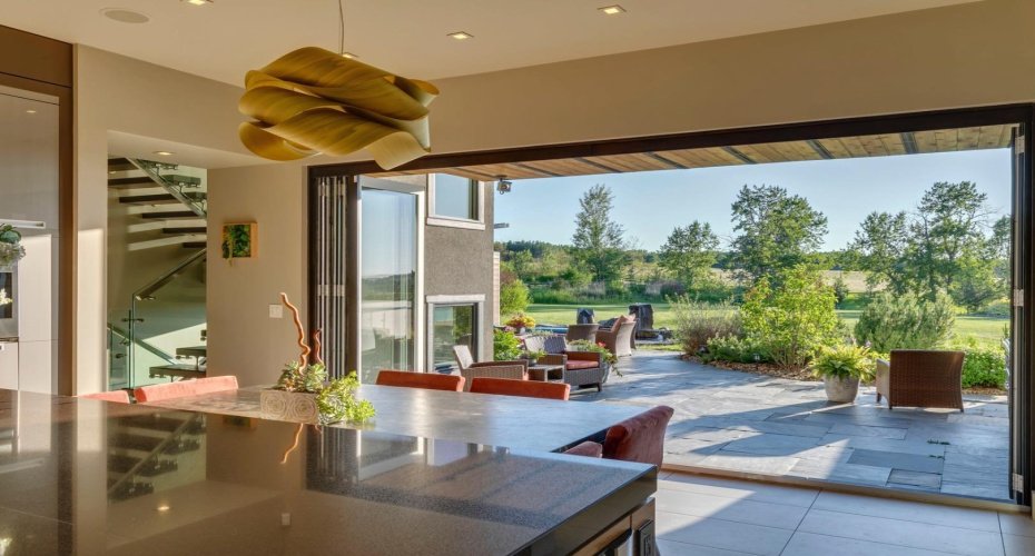 Ideal for entertaining, the NanaWall  opens up the kitchen space to the stunning rear grounds.