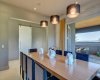 The dining area enjoys access to the covered (and screened) outdoor lounge.
