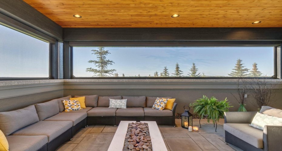 Outdoor lounge is fully screened, fire table is included. Wired for sound and TV it is a stunning extension of the living space.