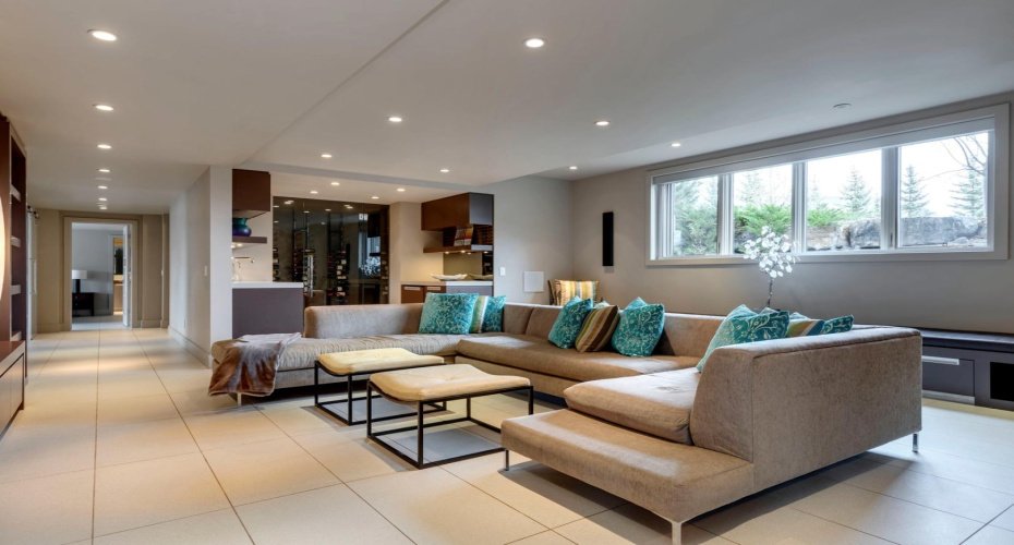 The walk-out level is bright &  thoughtfully designed with media, fitness and recreation in mind.