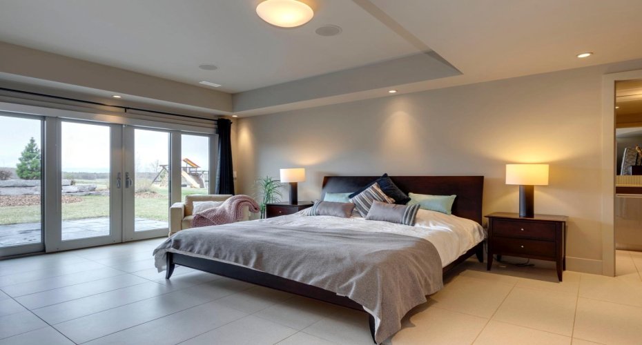 Lower level bedroom walks out to the rear grounds.