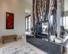 A stunning two-sided fireplace creates a dramatic focal point while adding warmth and ambiance throughout the space.