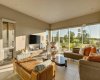The living area enjoys beautiful west-facing views over the rear grounds, while in-floor geothermal-heated tile throughout ensures year-round comfort.
