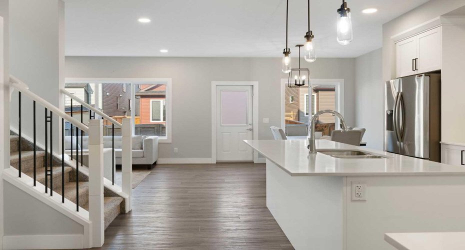 View from foyer to kitchen, dining room and living room