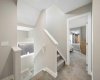 Second floor stairwell with view to primary retreat