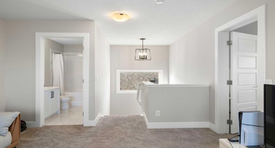 View from top floor den toward the bathroom and stairwell