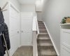 Doors to storage and mechanical room; stairs to separate entrance door