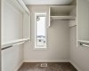 Bright primary walk-in closet