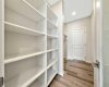 Walk-through pantry with melamine shelves