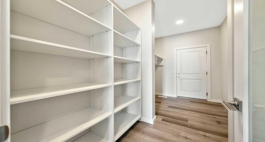 Walk-through pantry with melamine shelves