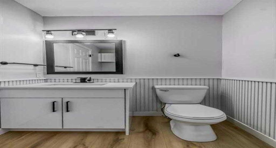 Main floor half bathroom with laundry