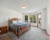 Primary bedroom with deck entry