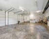 Huge triple garage with stair to lower level