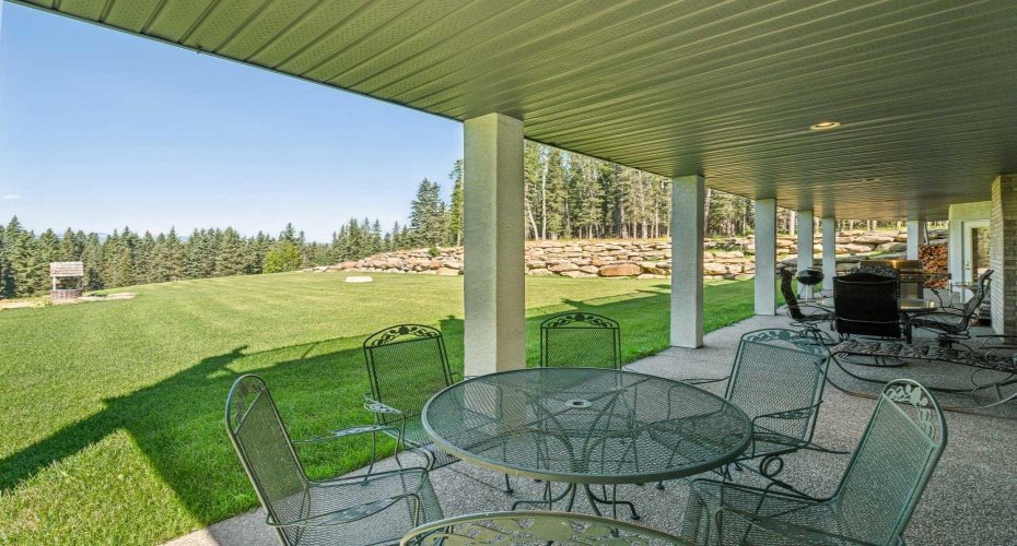 Part of lower level patio spanning entire rear