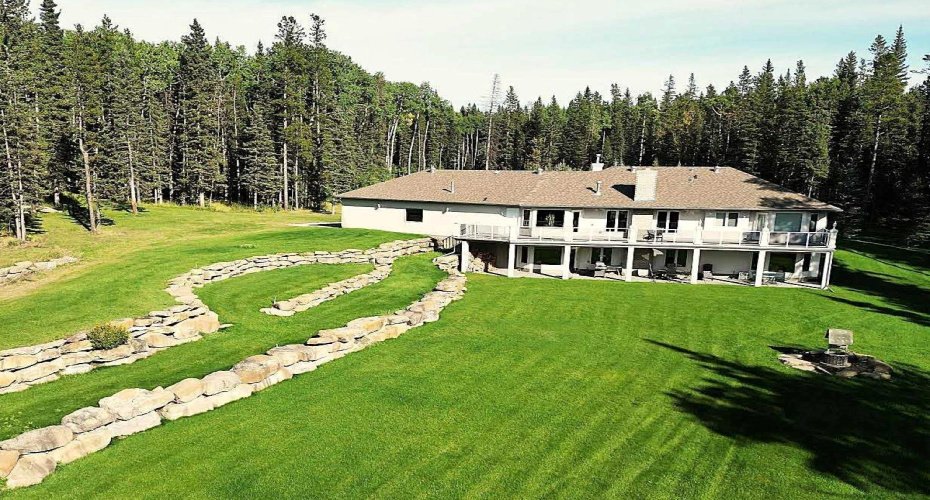 Rear deck and patio system with beautiful landscaping