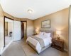 Virtually staged primary bedroom staged primary