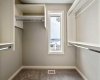 Bright primary walk-in closet