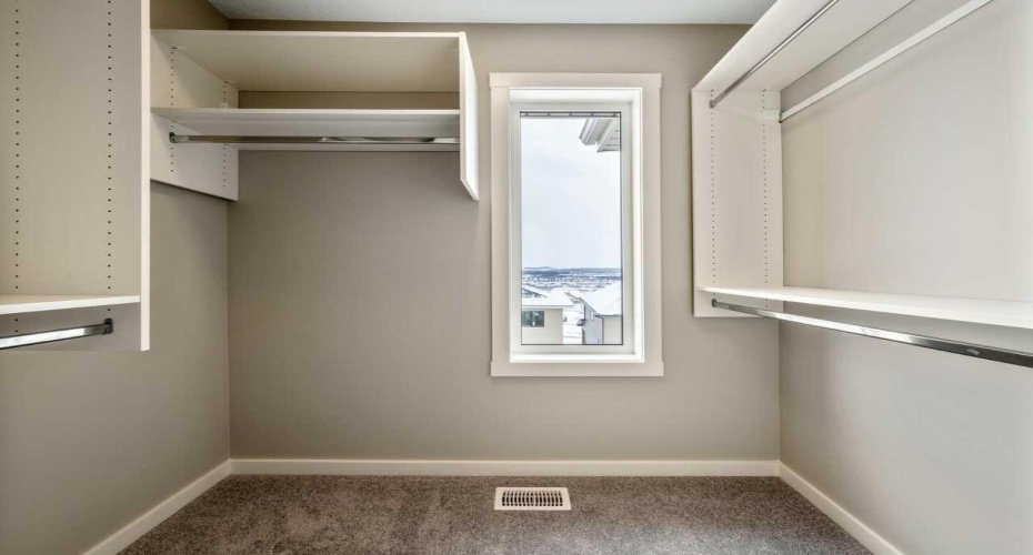 Bright primary walk-in closet