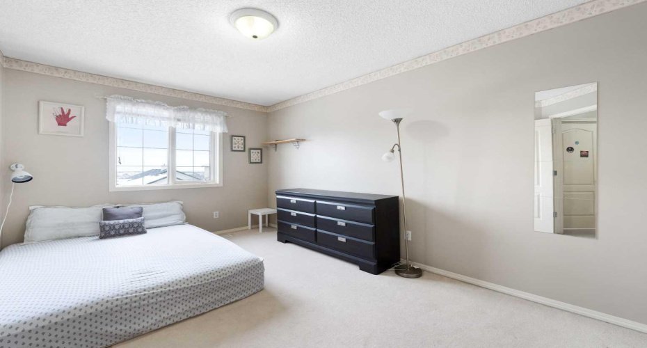 One of the three bedrooms located on the upper level...