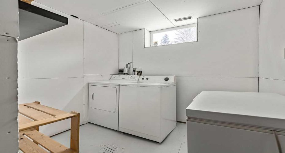 Dedicated laundry area with additional room for storage and everyday household organization.