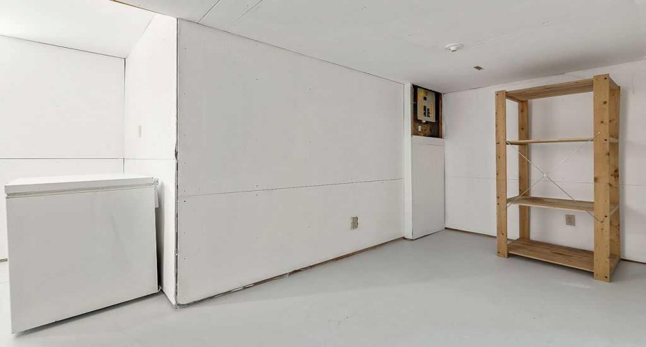 Large unfinished storage space provides practical room for seasonal items, tools, and long-term storage.