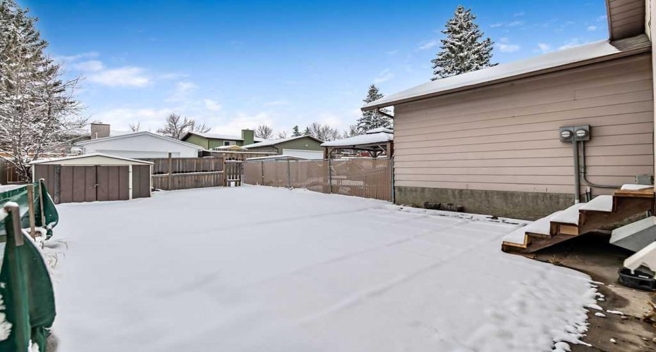 Expansive south-facing backyard offers plenty of sunlight and space for kids, pets, gardening, or future plans like a garage.