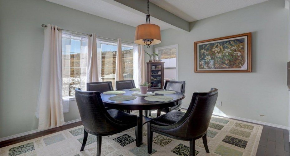 Sunny south facing dining area looking over the backyard and expansive green space