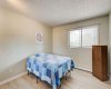 Primary bedroom with bright windows