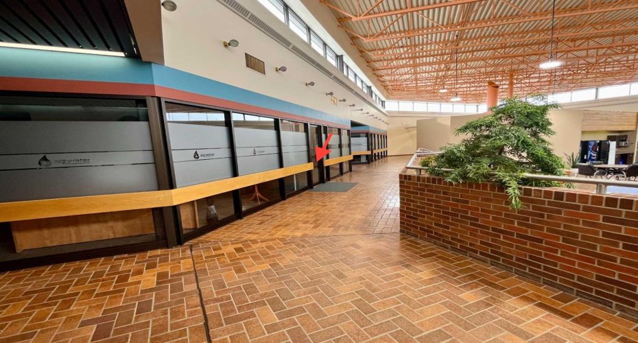 Hallway to left to #102